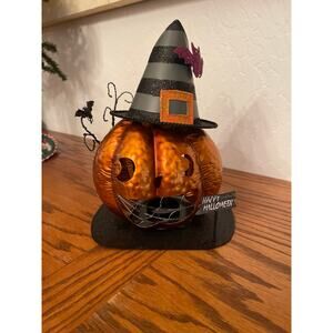 tin metal Halloween pumpkin tealight holder with a witch hat, glitter accents